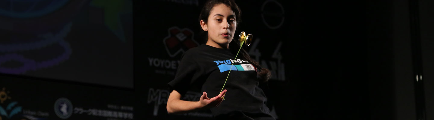 A teenager performing a yo-yo trick